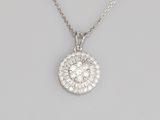 a white gold and diamond pendant on a chain