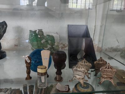 a glass display case with various items on it