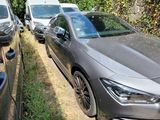 two cars parked next to each other on the side of the road