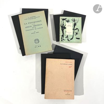 three books sitting on top of each other on top of a table