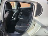 a car with the door open and the seats down