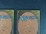 two decks of magic the gathering are shown on a table