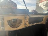 a dashboard of a car with a clock on it