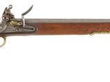 an old rifle with a wooden barrel and brass fittings on a white background