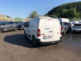 a white van that is parked in a parking lot
