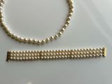 pearl necklace and bracelet set with gold tone clasp