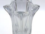 a glass vase that is sitting on a white surface