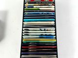 a rack of magazines on a table with a cup of coffee in the background