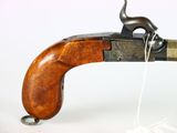 an old gun with a wooden handle on a white background