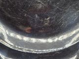 a close up of a silver plate on a stand