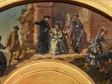 a painting of a group of people on a wall