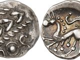 a close up of a coin with a horse on it