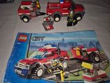 a lego city fire truck and a fire truck on a table