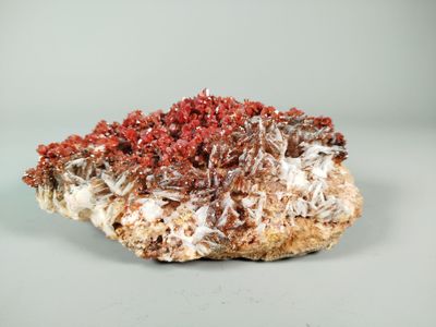 a piece of rock with a red substance on top of it