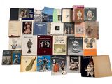 a lot of books that are sitting on a table