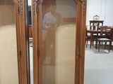 pair of antique carved wood armoires with glass doors