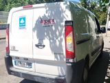 a white van that is parked on the side of the road