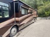 an image of a motor home parked in a parking lot