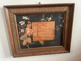 framed picture of a painting of a bird on a branch of a tree