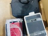 a black bag and some other items sitting on the floor