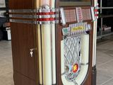 a juke box sitting in the middle of a room