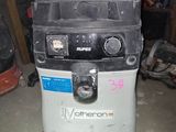 a machine that is sitting on the floor in the garage