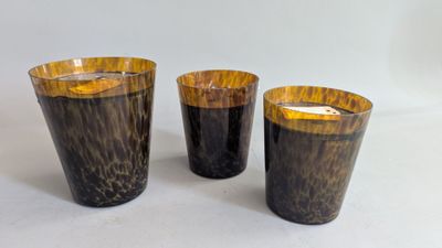 three candles that are sitting on a table