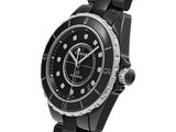 a close up of a watch on a white background with a white background