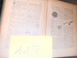un livre ouvert sur lequel se trouve une feuille de papier