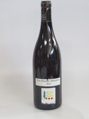 a bottle of wine that is sitting on a table