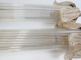 pair of clear glass lamps with gold trims on a white background