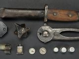a knife, pliers, nuts, screws and other items on a table