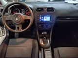 dashboard view of a car with a steering wheel and dashboard controls