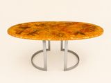 une table ronde avec un piètement en métal et un plateau en marbre