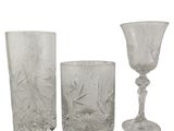 three glass vases sitting next to each other on a white surface