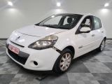 a picture of a small white car in a showroom