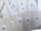 many different types of rings on display in a display case
