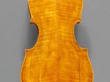 an old violin with a wooden back and a long neck