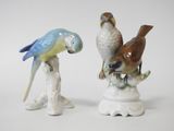 two figurines of birds sitting on top of each other