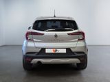 the rear end of a white car in a white room