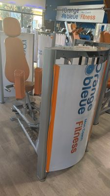 an image of a gym area with a bar and exercise equipment