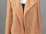 a woman ' s orange and black jacket on a mannequin mannequin mannequin mannequin mannequin mannequin mannequin mann