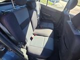 the back seats of a car are empty in a parking lot