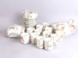 a lot of white dishes and cups on the table