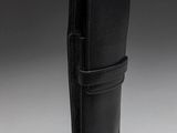 a black leather case with a metal clasp on a gray background