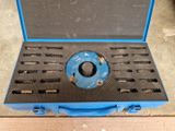 a blue tool case with tools in it sitting on a table