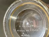 a close up of a glass with writing on it