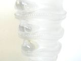 a glass vase that has a spiral design on it