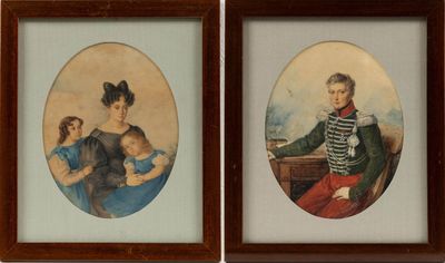 two framed portraits of a man and a woman with a child