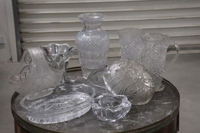 a table with a lot of glass items on top of it
